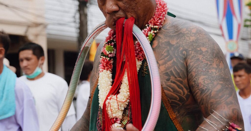 Man with Tattoos and Piercing on Traditional Festival