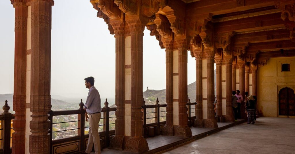 Man Standing on Terrace and Admiring a Landscape